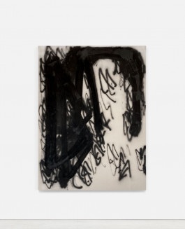 A raw canvas, adorned with minimal black spray paint symbols created by the Barcelona artist Esther Miquel, is displayed on a white wall