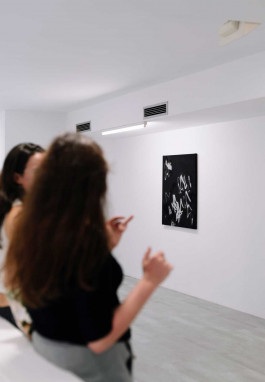 Two women at the opening of Silent Noise, a solo show by Esther Miquel at Galeria Fran Reus in Palma de Mallorca.