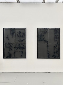 Two black and transparent paintings by Esther Miquel are hanging on a white wall in Fran Reus Gallery booth at Untitled Art Fair of Miami Beach 2023
